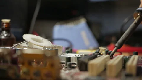 Master repairs the computer motherboard. Condenser explosion Stock-Footage 99090681