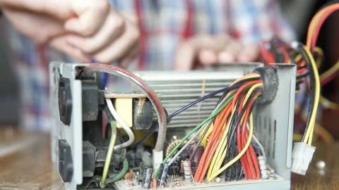 Master repairs computer power supply Stock Footage 103352635