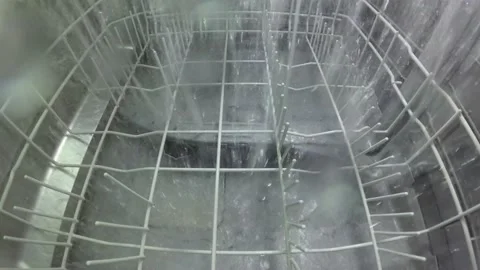 The master repairs the dishwasher and checks the operation of the nozzle mech Stock Footage 143703952