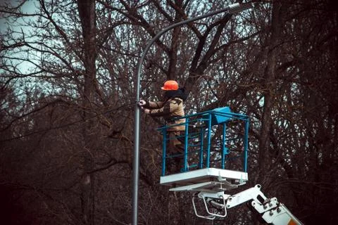 The master repairs the lamppost Stock Photos