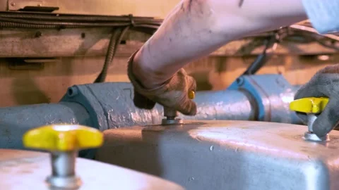 Master repairs the main ship engine. Stock Footage 142935220