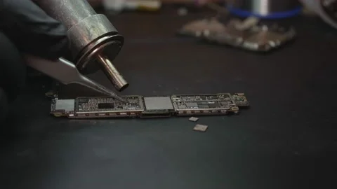 The master repairs the phone circuit board close-up Stock Footage 172057357