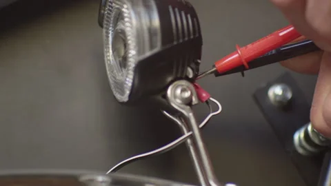 A master repairs a rare car headlight Stock Footage 265085533
