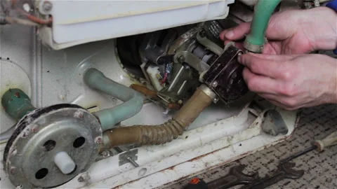 The master repairs the washing machine Stock Footage 87734992