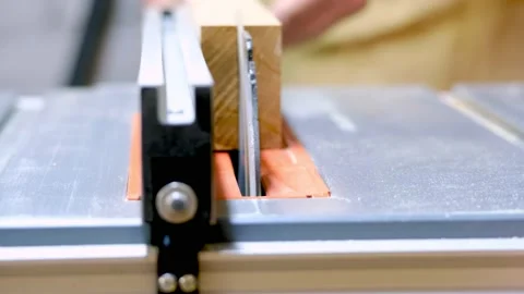 The master saws the board with a circular saw Video stock 177008482