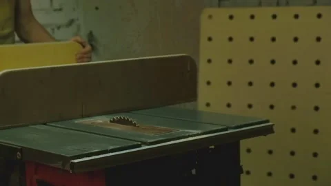 The master saws boards on a circular saw Stock-Footage 182221019