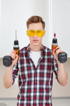 Master with screwdriver and drill Stock Photos