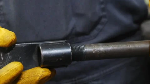 Master screws detail into compartment working with gloves Stock Footage 317637394
