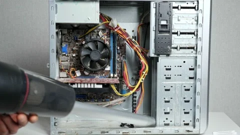 Master of the service center cleans the system unit with a vacuum cleaner Stock Footage 165032588