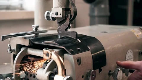 The master sews leather on a sewing machine, sewing of leather goods Stock Footage 151207792