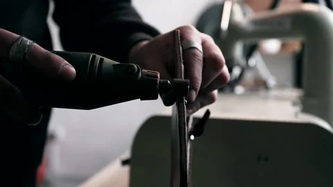 The master sews leather on a sewing machine, sewing of leather goods Video stock 151207798