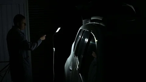 Master shines a lamp on the side of the body:the closeup and medium shot Stock Footage 74375872