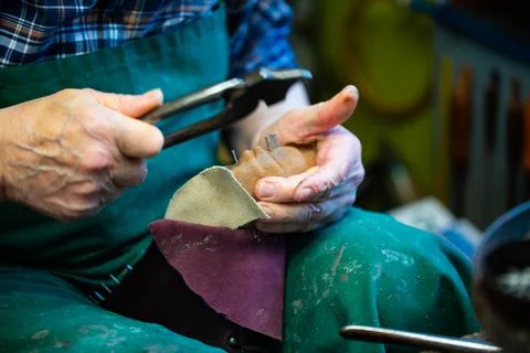 Master shoemaker producing shoes, master orthopedic, master orthopedic Stock Photos