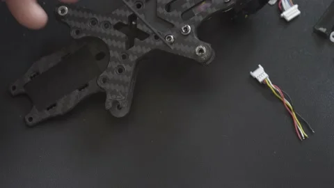 Master shows damage on the FPV drone's carbon frame Video stock 149774181