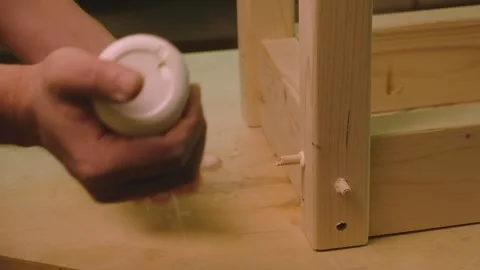 The master smears the sheets with glue and inserts them into the holes Stock Footage 182220279