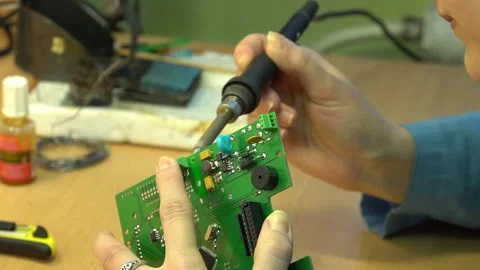 The master solders the printed circuit board Stock Footage 157758441