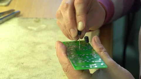 The master solders the printed circuit board Stock Footage 157758886