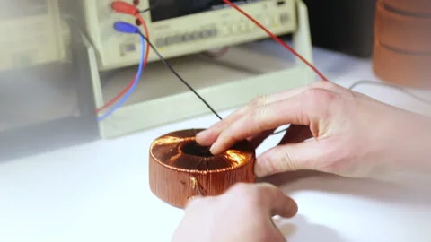 The master solders the transformer by hand. Stock Footage 165581928