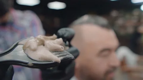 The master squeezes the paint onto a brush Stock Footage 144668392