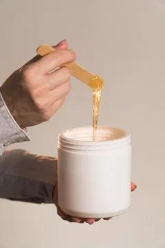 Master stretches paste for shugaring close-up vertical frame Stock Photos