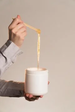 Master stretches paste for shugaring close-up vertical frame Stock Photos