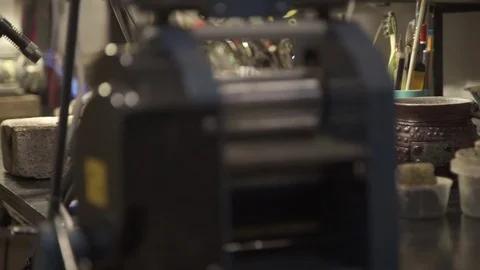 Master in the studio heats chunk metal on stone with an open fire Stock Footage 73286339