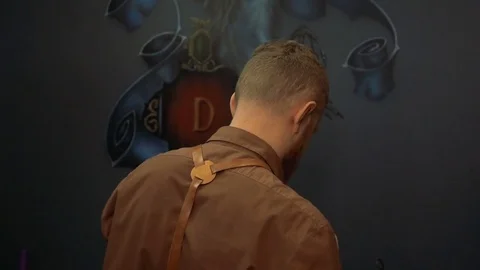 Master in the studio is immersed in the workflow Stock Footage 73464133