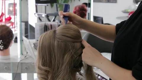 Master stylist makes the bride wedding hairstyle Stock Footage 73442844
