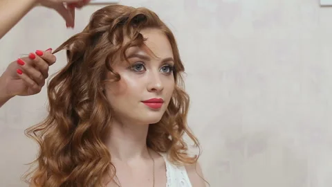 Master stylist makes the bride wedding hairstyle using spray lacquer fixing Video stock 93688809