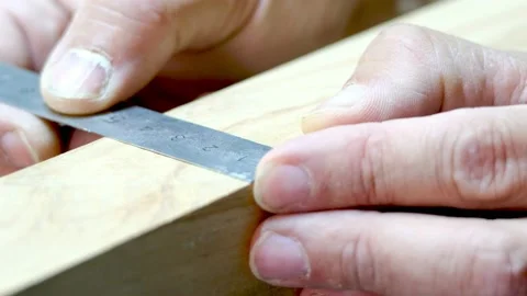 The master takes measurements on the board Video stock 177003455