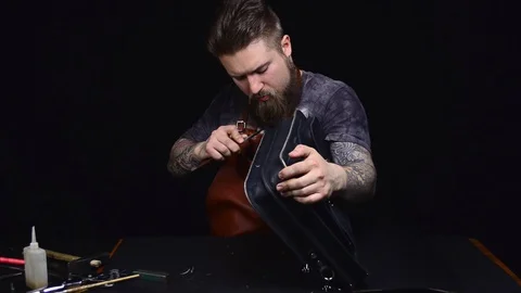 The master tanner in the studio working Stock Footage 107939873