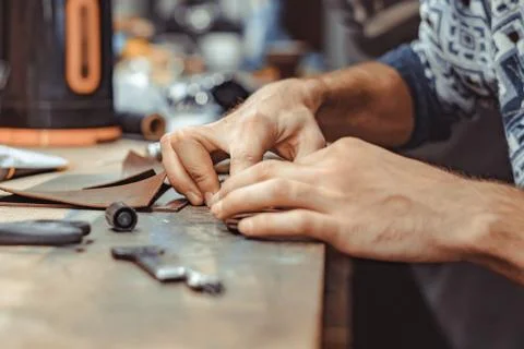 Master Tanner works in the workshop Stock Photos