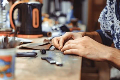Master Tanner works in the workshop Stock Photos