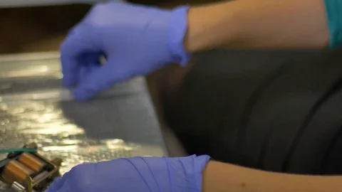 Master tattoo artist prepares tools for tattooing Stock Footage 70533960