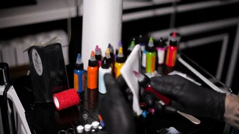 Master tattoo artist prepares tools for tattooing Stock Footage 73588210