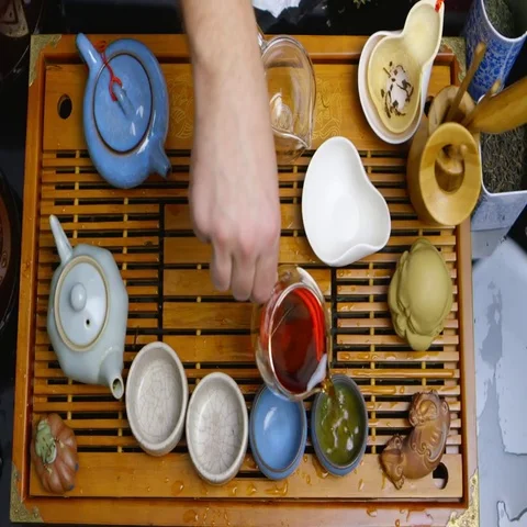 Master of tea does the tea ceremony with the tea set, da hong pao tea Stock Footage 69460793