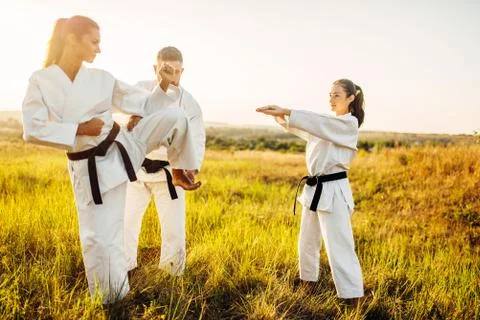 Master teaches karate fighters the correct stand Stock Photos