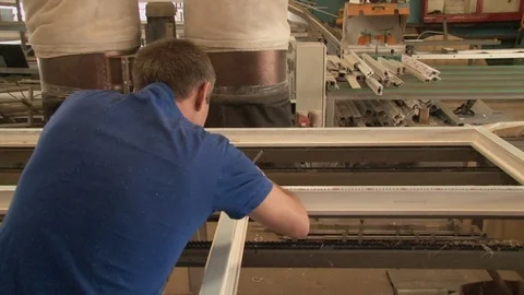 Master tightening the set screws into the frame Stock Footage 75155726