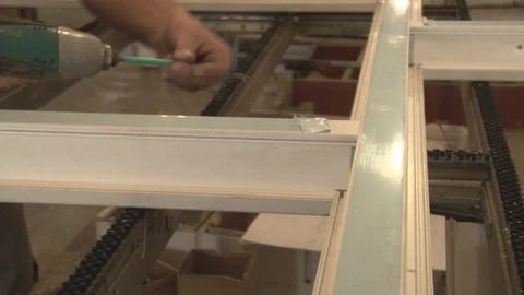 Master tightening the set screws into the frame Stock Footage 75155777