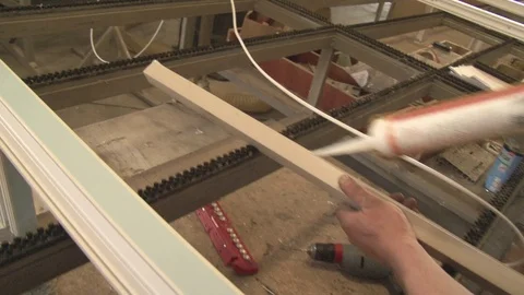 Master tightening the set screws into the frame Stock Footage 75155990