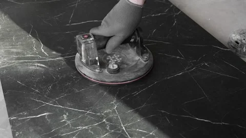 Master tiler installs a vacuum suction cup to transfer tiles Stock Footage 306019150