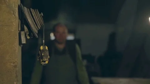 Master took the yellow roulette that hangs near the grinding wheels 스톡 동영상 77026710