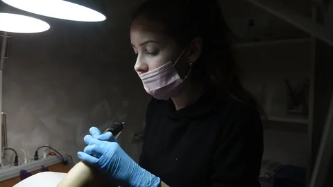 Master uses an electric machine to remove the nail polish during manicure Video stock 120908133