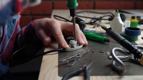 Master using screwdriver on switch Stock Footage 101754153