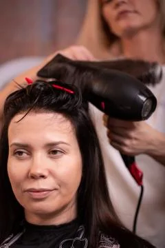 Master washes the head of the client in the Barber shop, hairdresser makes Stock Photos