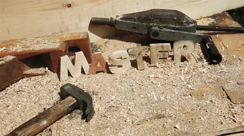 Master Word on the workbench Brush sweeps sawdust Video stock 51459081