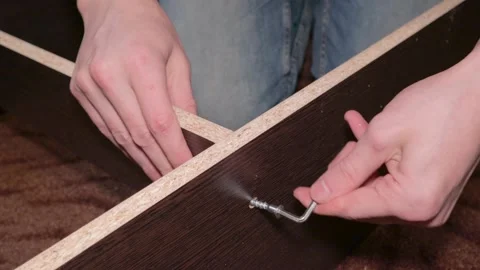 Master worker man assembling furniture bed components repair tools Vídeo Stock 148748702
