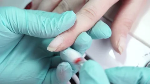 Master is working with the client's nails using a manicure machine Stock Footage 194463823
