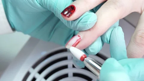 Master is working with the client's nails using a manicure machine Stock Footage 194463870