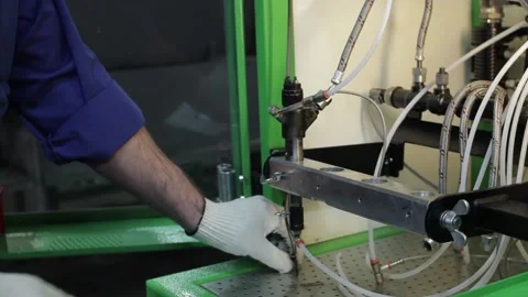 The master works with complex hydraulic equipment Stock Footage 145660858
